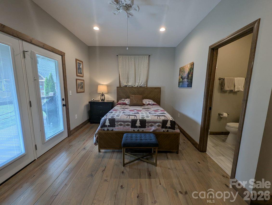 10 Rio Bravo Drive, Unit 4 Sylva, NC 28779 - Photo 23 of 33 a living room with furniture and a wooden floor