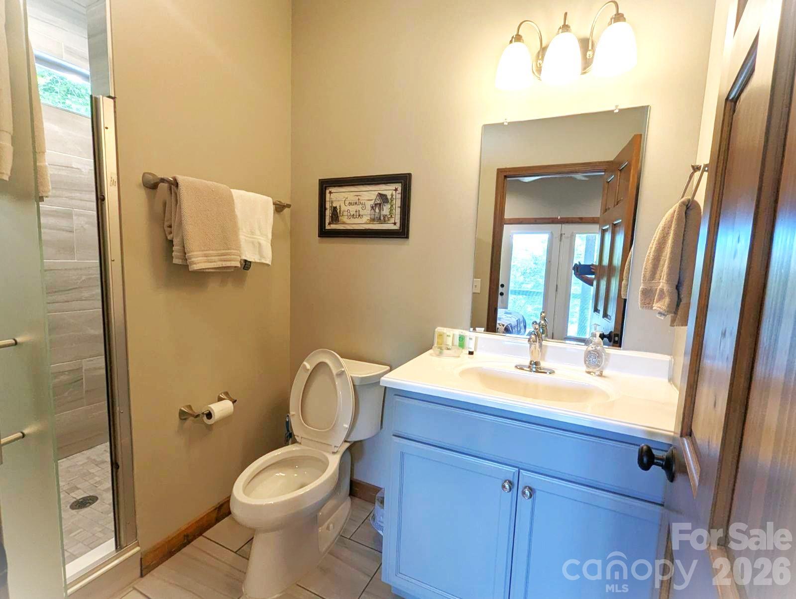 10 Rio Bravo Drive, Unit 4 Sylva, NC 28779 - Photo 24 of 33 a bathroom with a sink toilet and shower