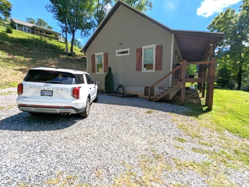 10 Rio Bravo Drive, Unit 4 Sylva, NC 28779 - Photo 4 of 33 a view of a backyard with a car parked in it