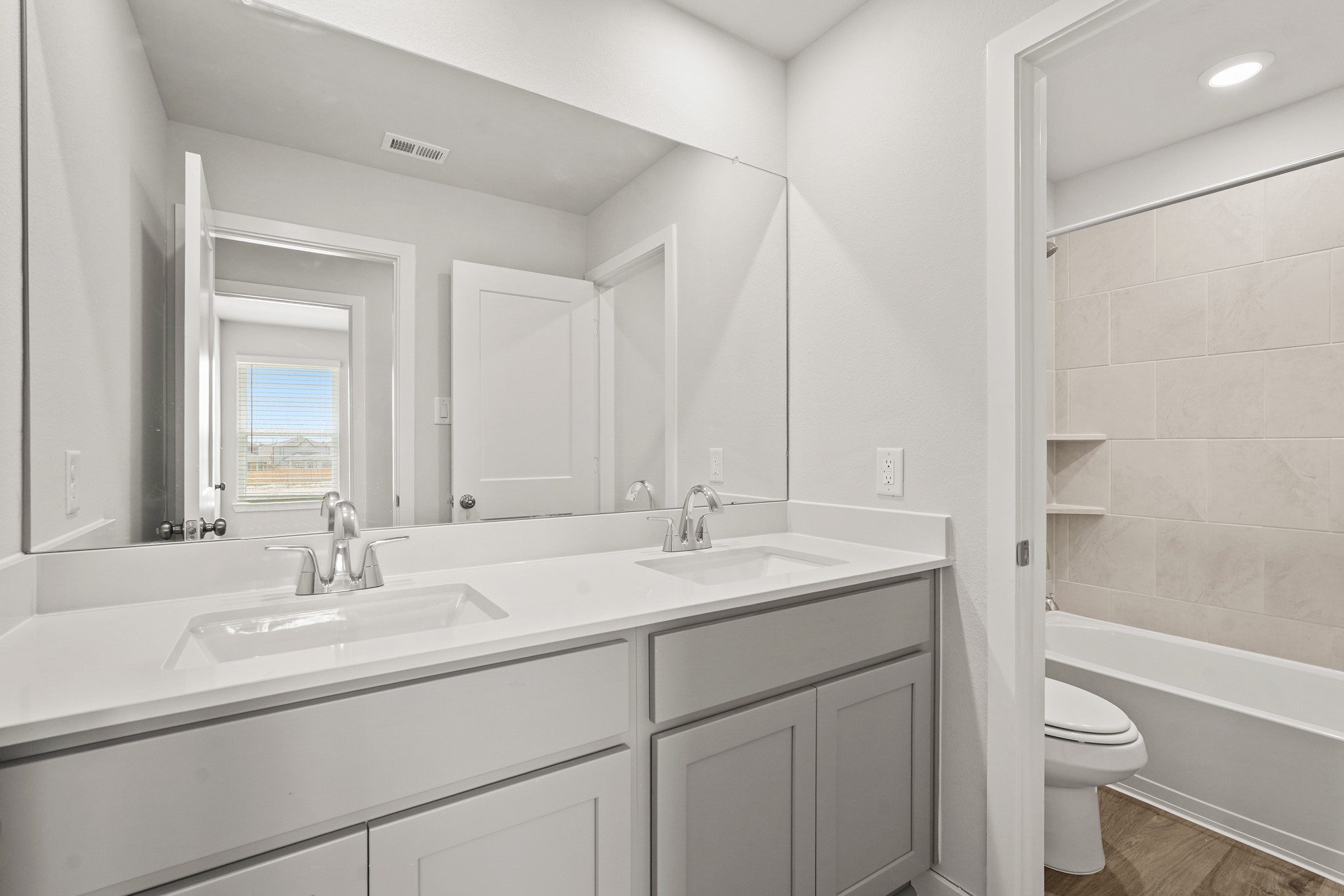 213 Spring Drive Hockley, TX 77447 - Photo 20 of 26 a bathroom with a sink toilet and shower