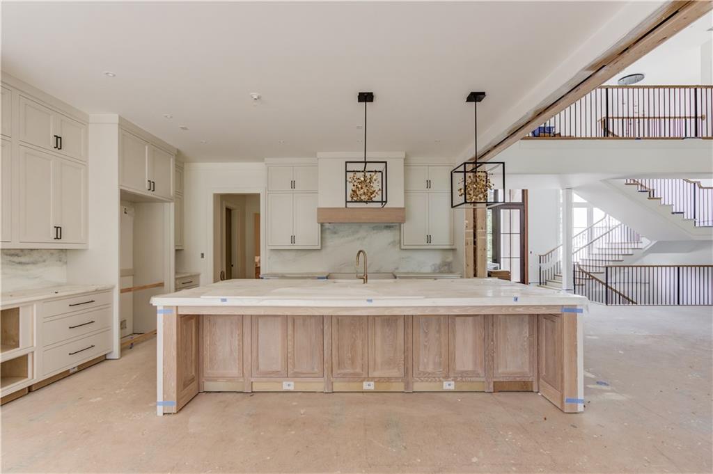 4635 Whitestone Way Suwanee, GA 30024 - Photo 11 of 27 a spacious bathroom with a sink and a mirror