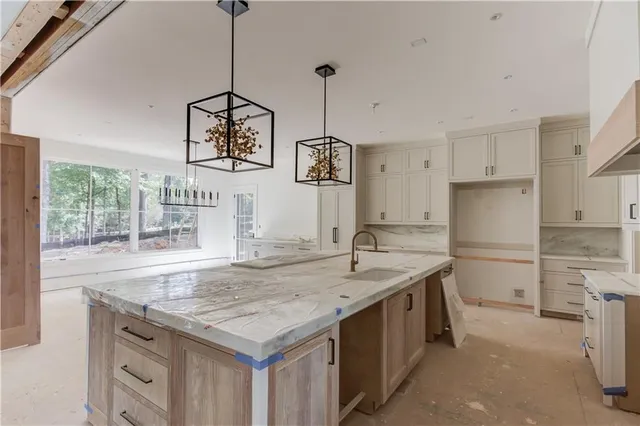 a kitchen with a stove a refrigerator a sink and dishwasher