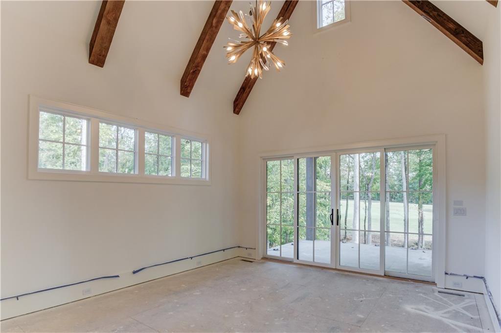 4635 Whitestone Way Suwanee, GA 30024 - Photo 13 of 27 a view of an empty room with windows