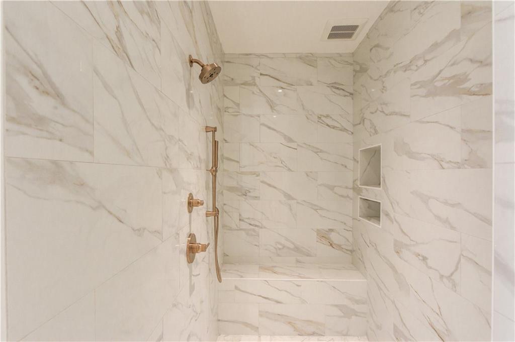 4635 Whitestone Way Suwanee, GA 30024 - Photo 19 of 27 a bathroom with a shower