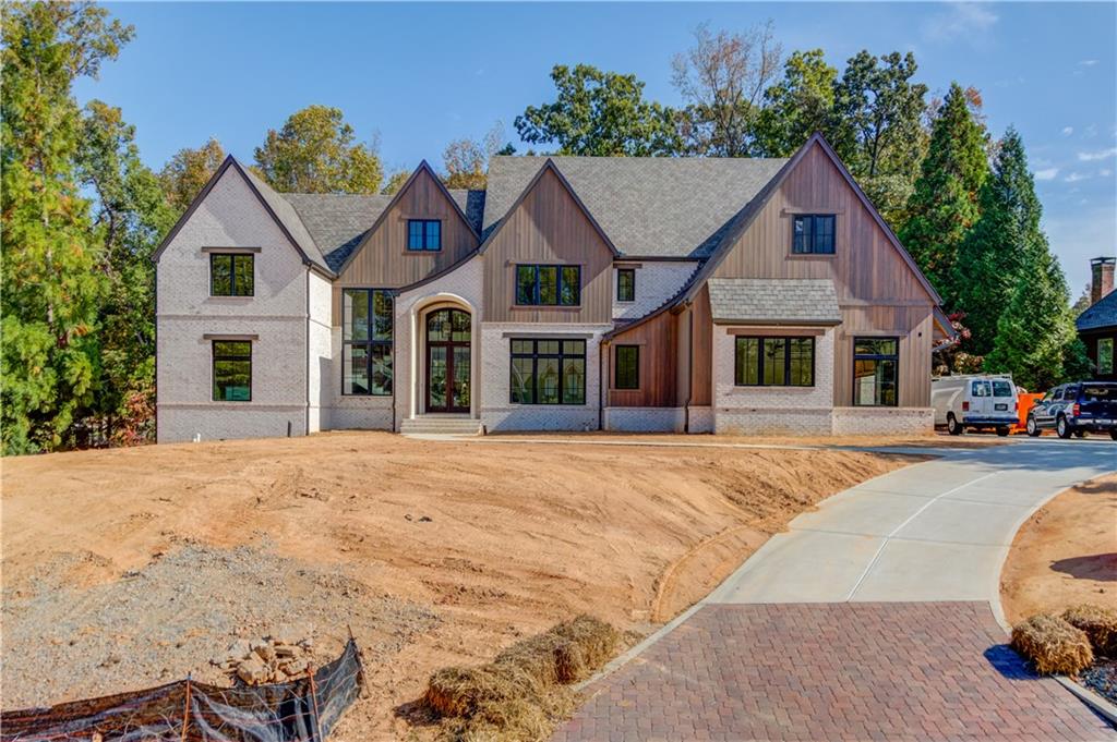 4635 Whitestone Way Suwanee, GA 30024 - Photo 2 of 27 a view of a white house with a yard and large tree