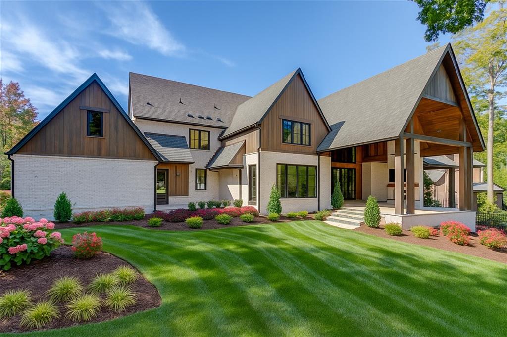 4635 Whitestone Way Suwanee, GA 30024 - Photo 24 of 27 a front view of house with yard