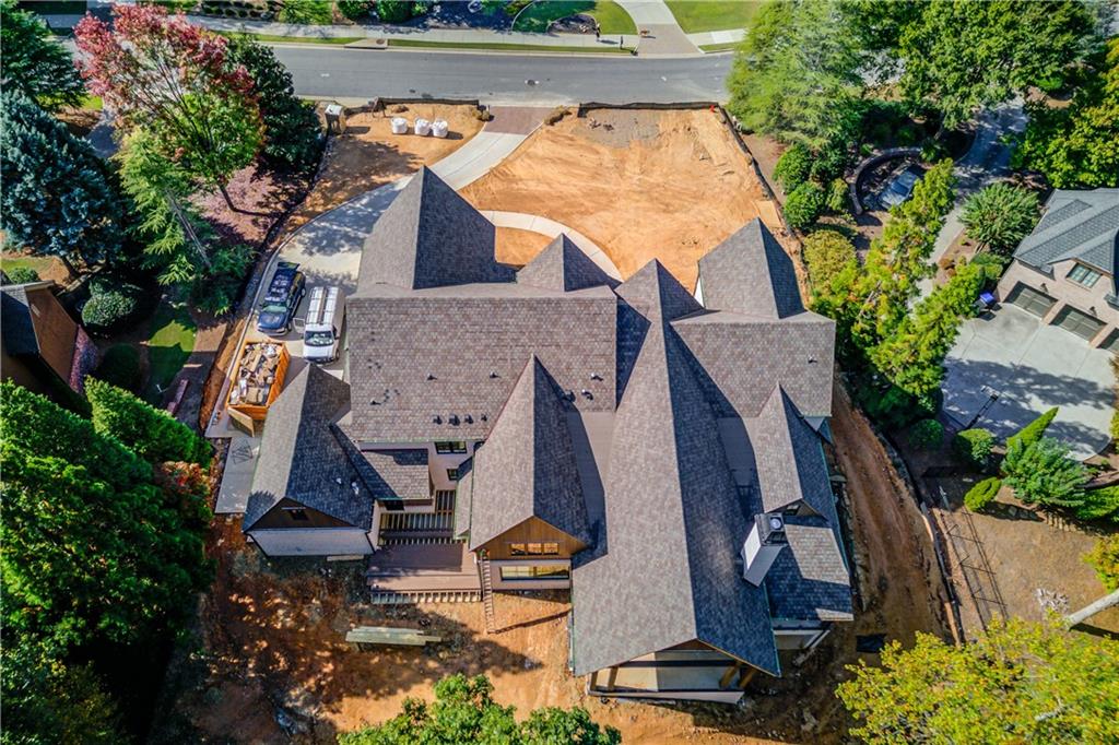 4635 Whitestone Way Suwanee, GA 30024 - Photo 26 of 27 an aerial view of a house with garden space and street view