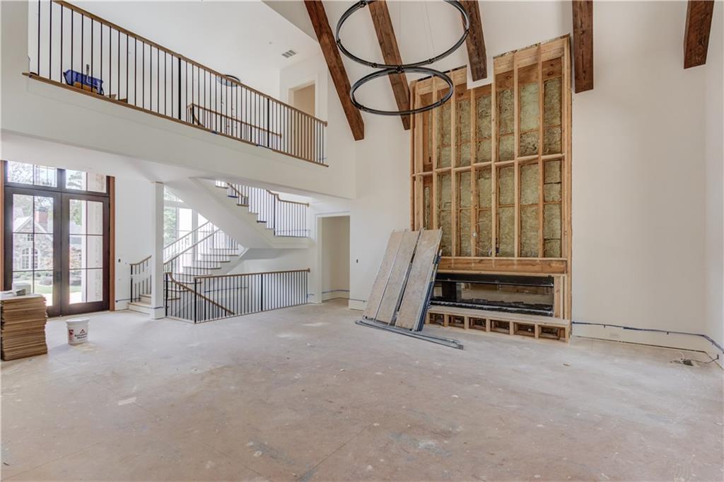 4635 Whitestone Way Suwanee, GA 30024 - Photo 8 of 27 a view of an empty room with wooden floor