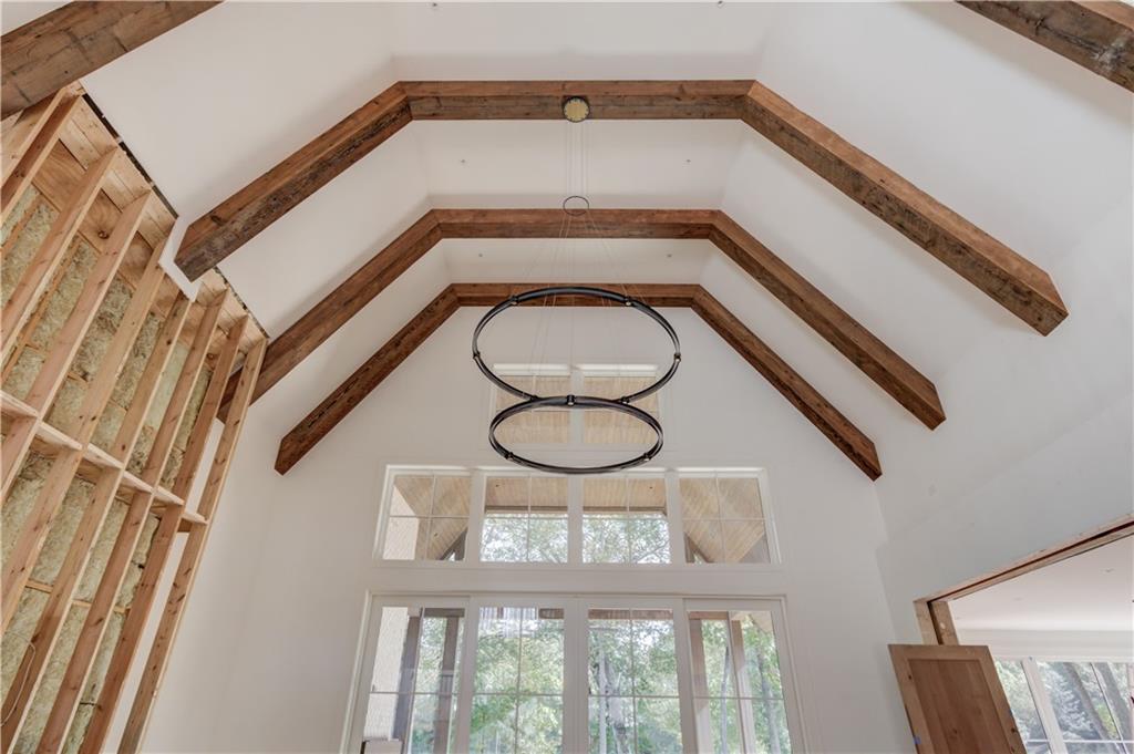 4635 Whitestone Way Suwanee, GA 30024 - Photo 10 of 27 a view of a hallway with a large window and wooden floor