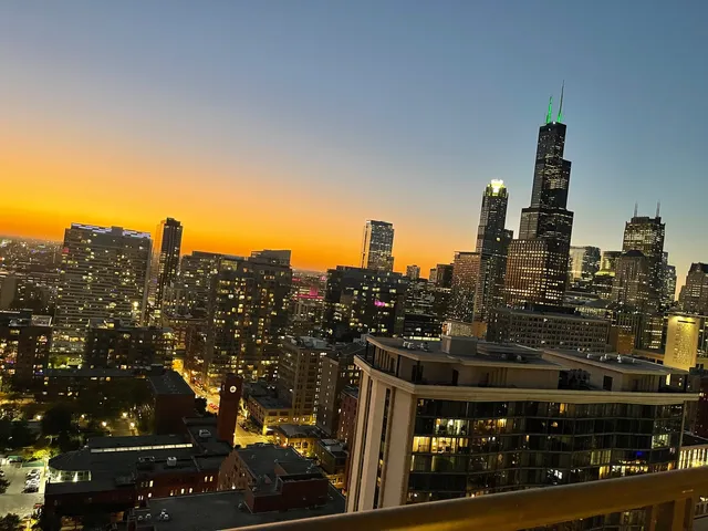 a view of a balcony with floor to ceiling window