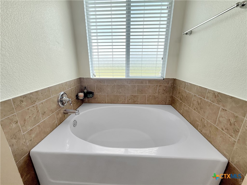 305 Brunswick Temple, TX 76502 - Photo 12 of 28 a bathroom with a bathtub