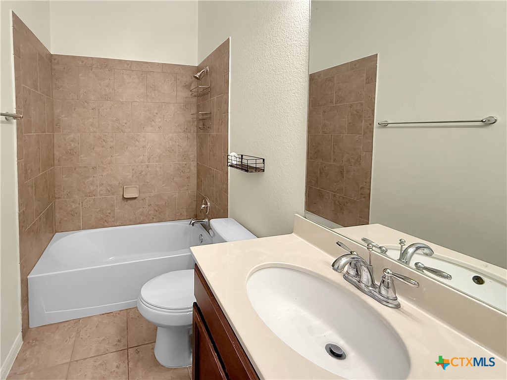 305 Brunswick Temple, TX 76502 - Photo 14 of 28 a bathroom with a sink toilet and shower