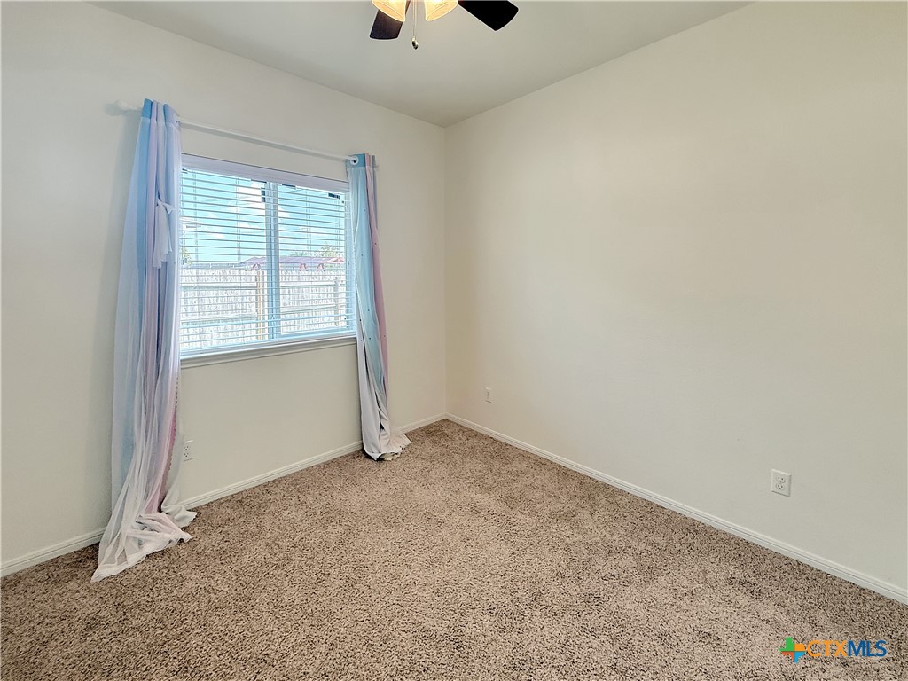 305 Brunswick Temple, TX 76502 - Photo 17 of 28 an empty room with a empty space and windows