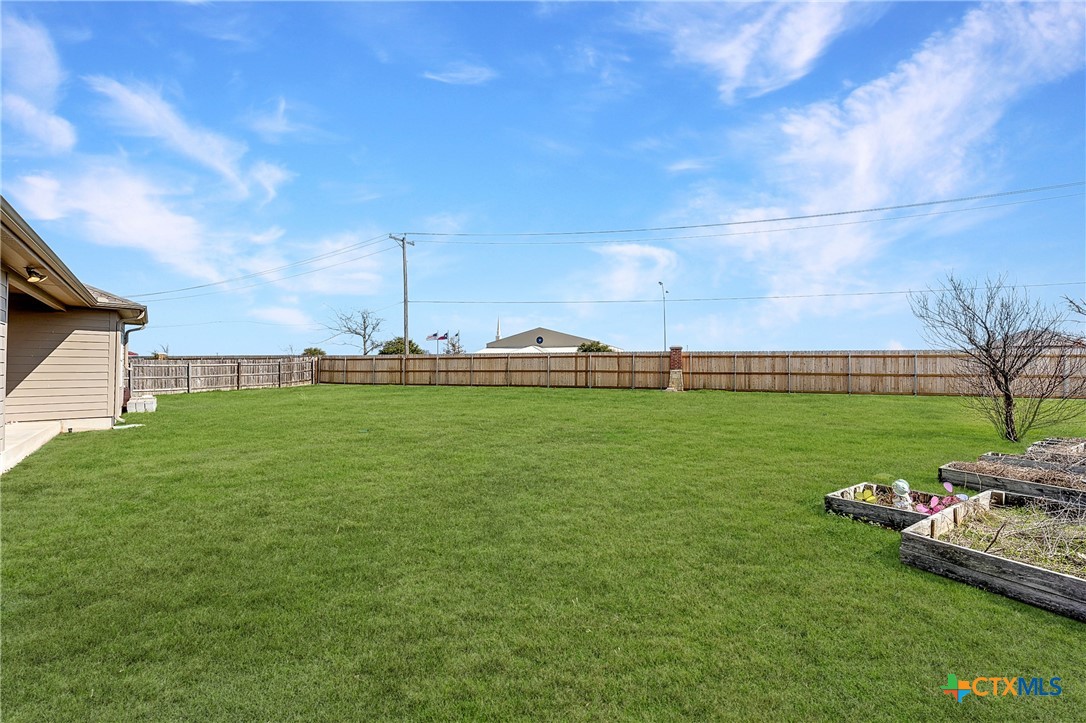 305 Brunswick Temple, TX 76502 - Photo 21 of 28 a backyard of a house with lots of green space