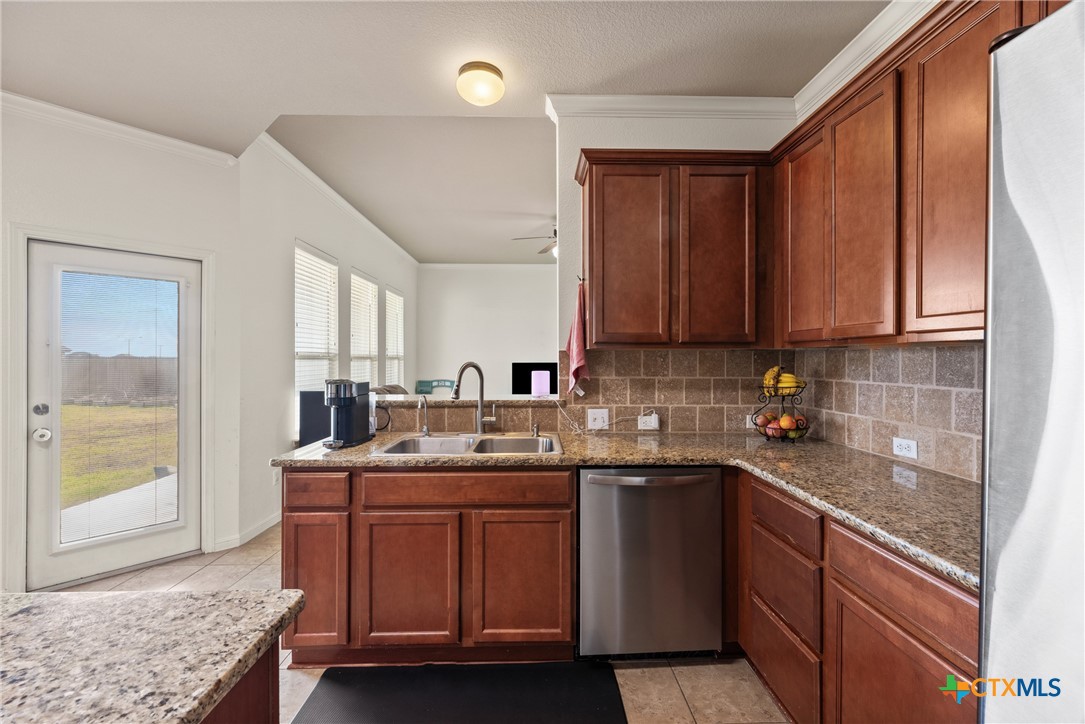 305 Brunswick Temple, TX 76502 - Photo 28 of 28 a kitchen with a sink a stove and cabinets