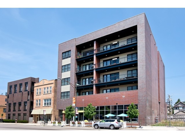 1842 West Irving Park Road, Unit 202 Chicago, IL 60613 - Photo 1 of 20 a front view of building with streets and trees