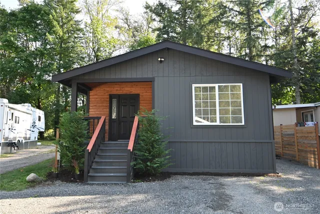 a front view of a house with garden