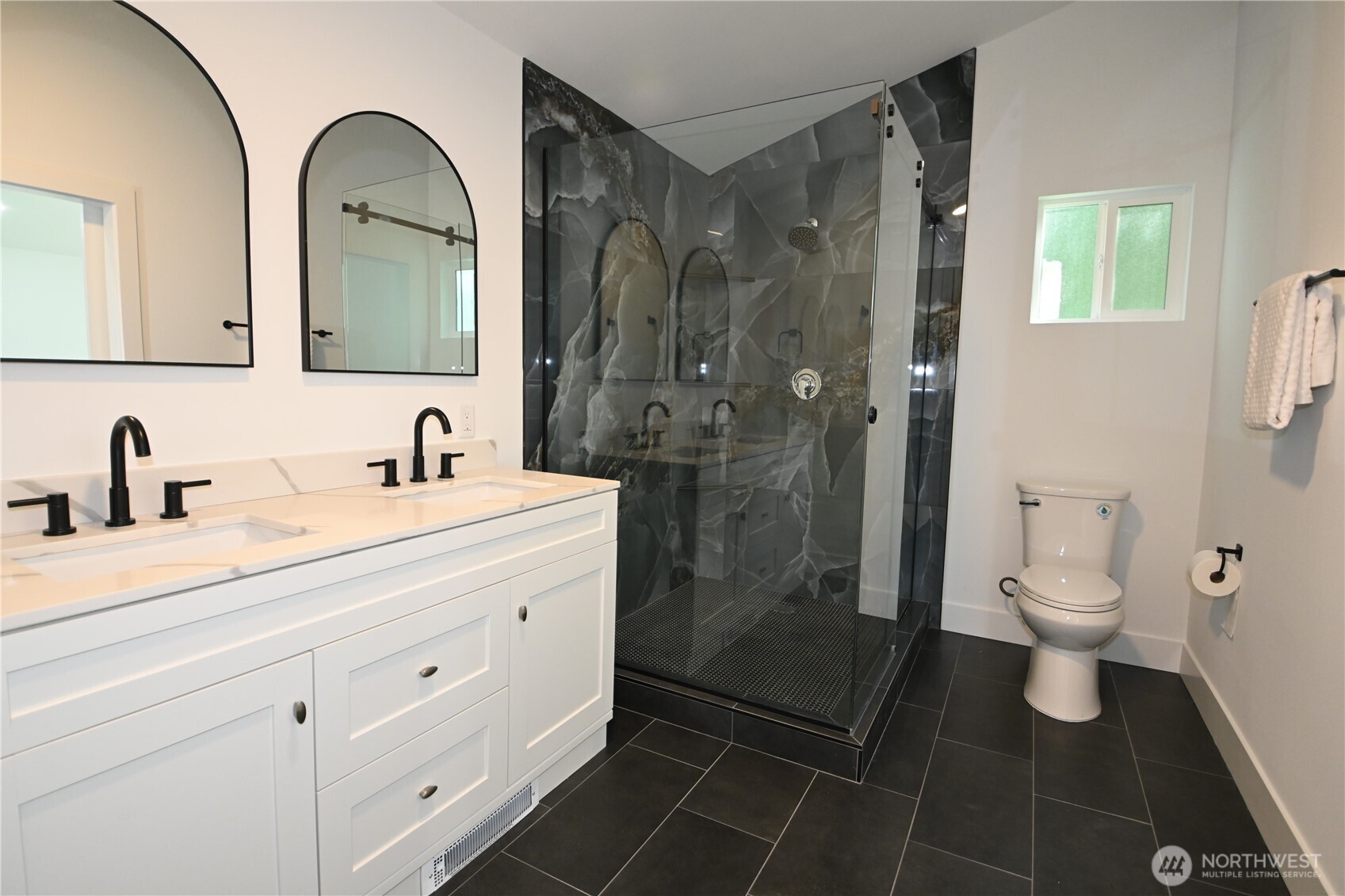 36010 State Route 2, Unit 2 Sultan, WA 98294 - Photo 17 of 28 a bathroom with a double vanity sink a toilet and a mirror