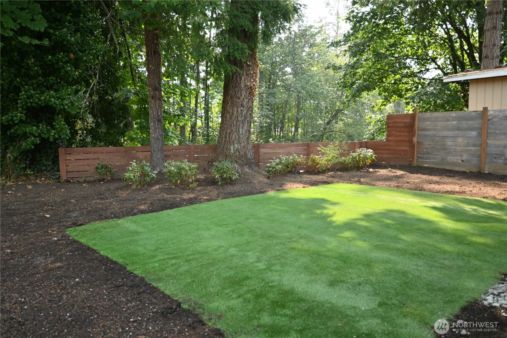 36010 State Route 2, Unit 2 Sultan, WA 98294 - Photo 4 of 28 a view of a backyard with a trees