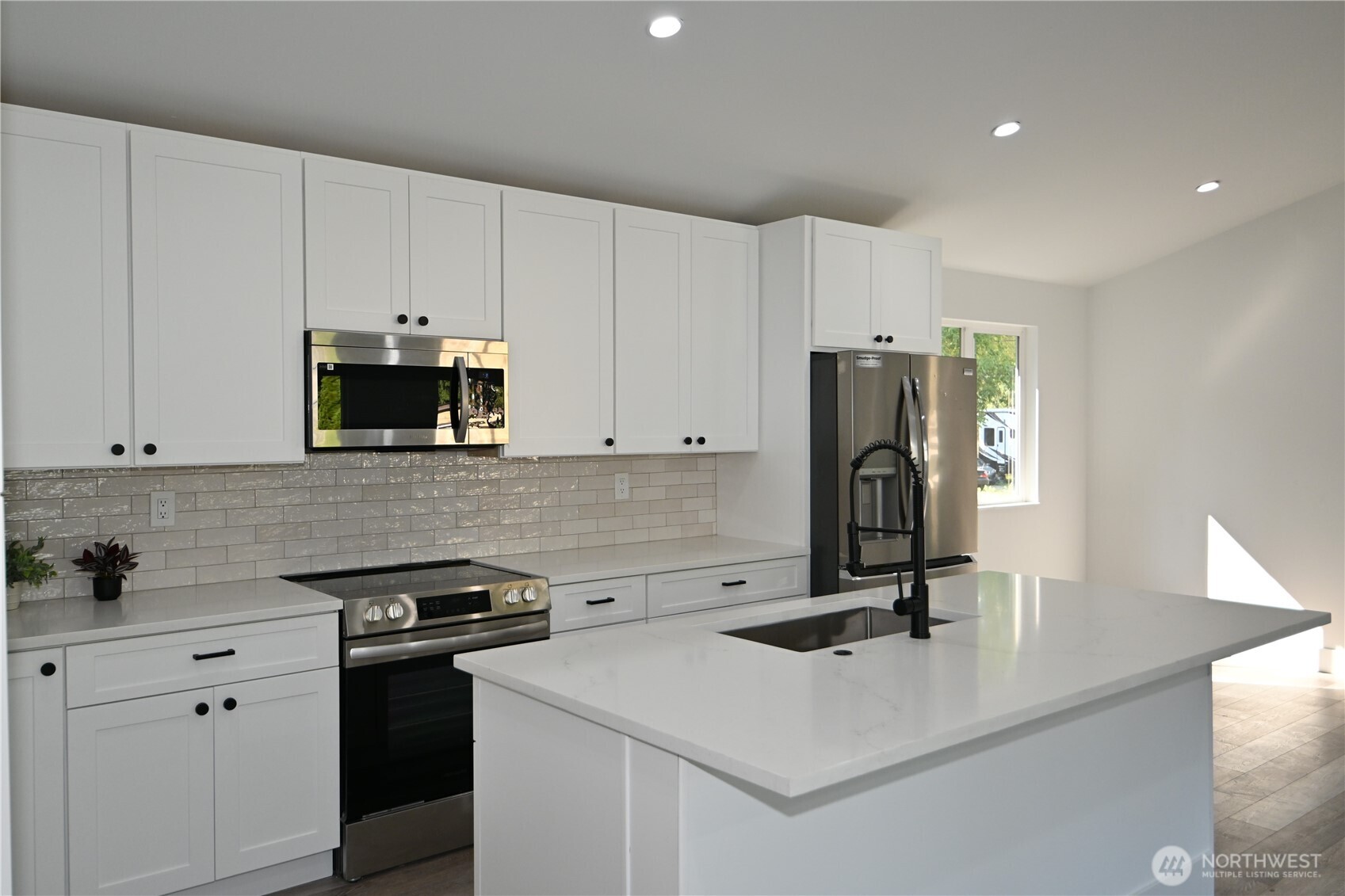 36010 State Route 2, Unit 2 Sultan, WA 98294 - Photo 7 of 28 a kitchen with a sink a stove and a refrigerator