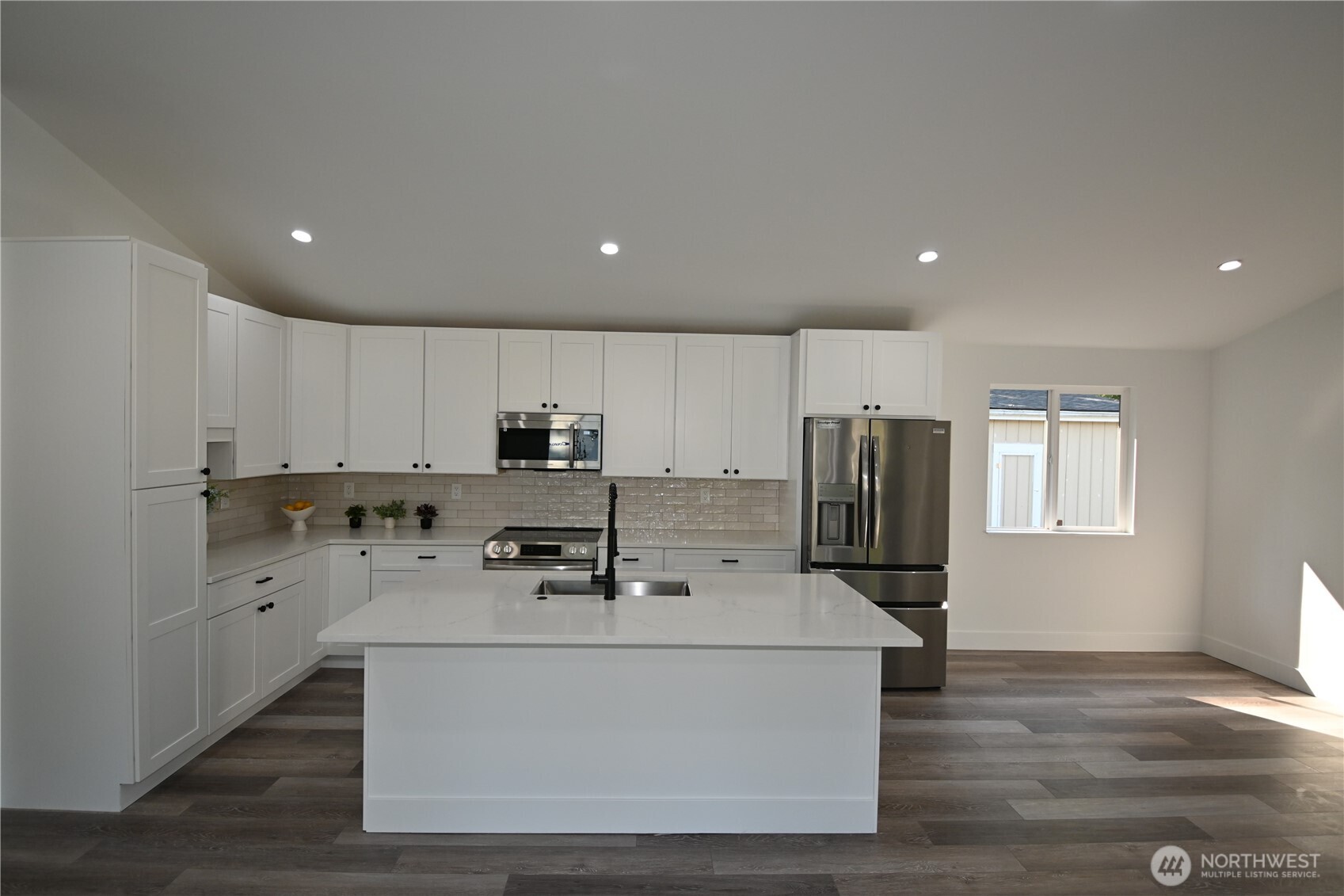 36010 State Route 2, Unit 2 Sultan, WA 98294 - Photo 9 of 28 a view of kitchen with stainless steel appliances sink refrigerator and window