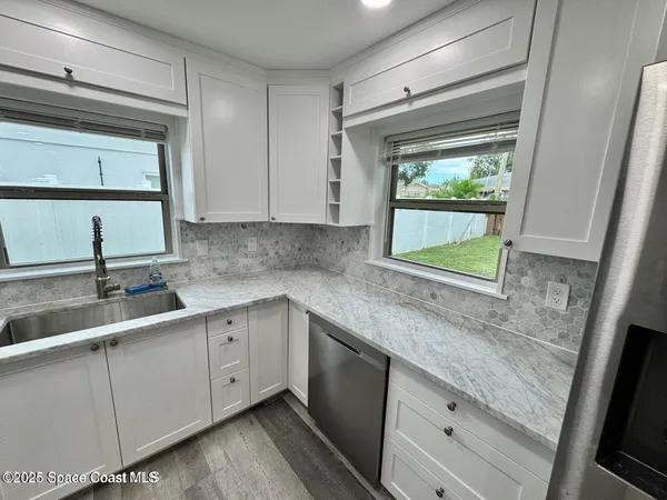 a kitchen with a sink and cabinets