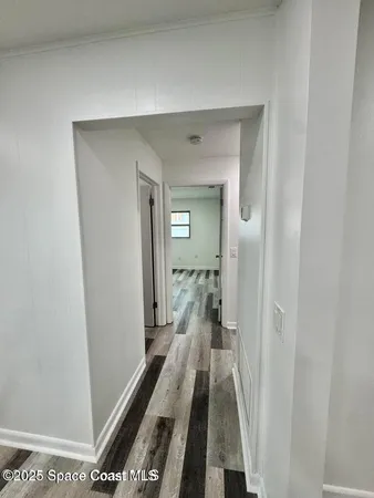 a view of a bathroom from the hallway