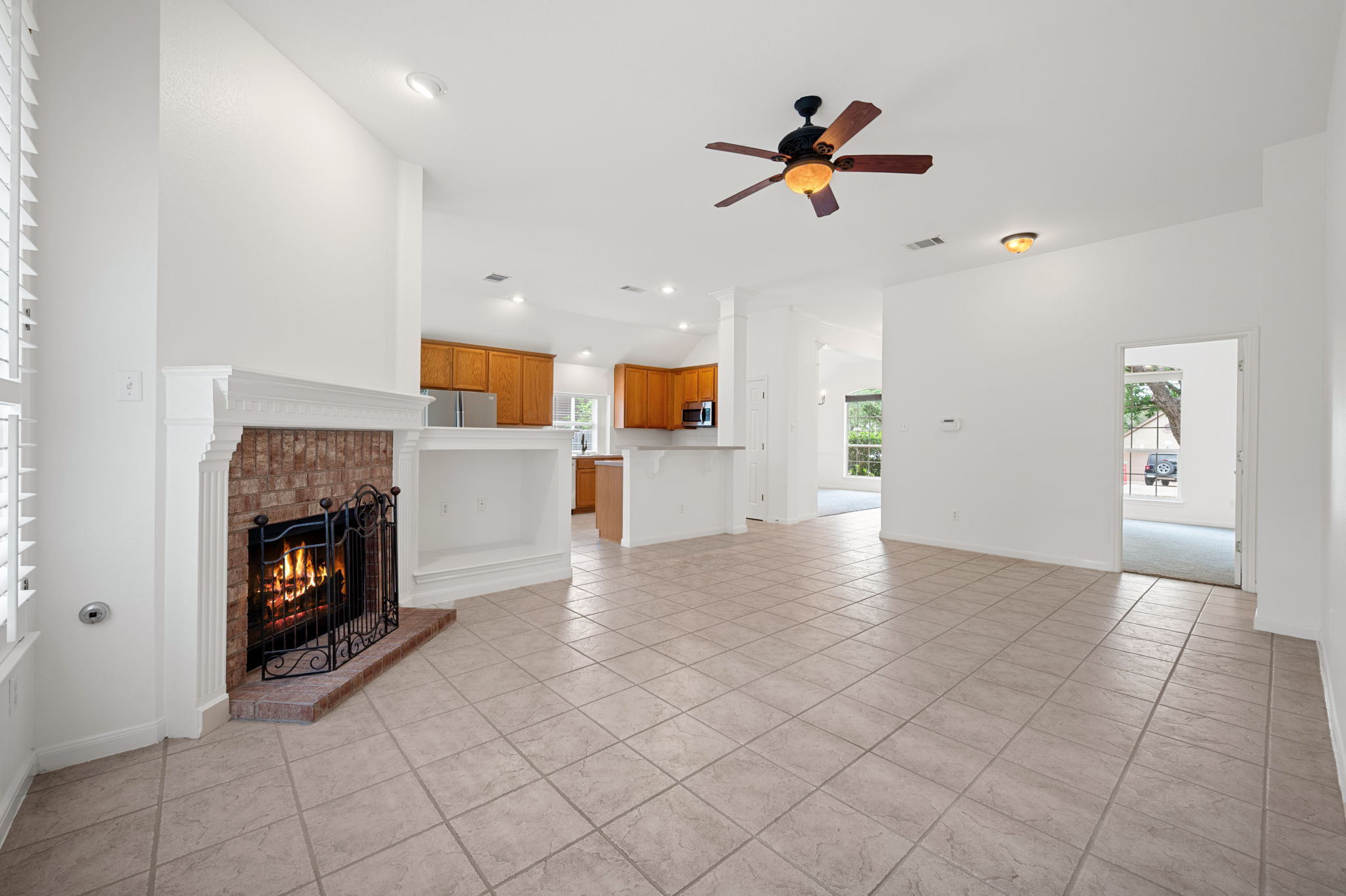 9201 La Siesta Bend Austin, TX 78749 - Photo 7 of 37 an empty room with windows and fireplace