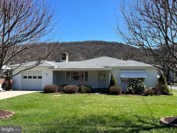 front view of a house with a garden