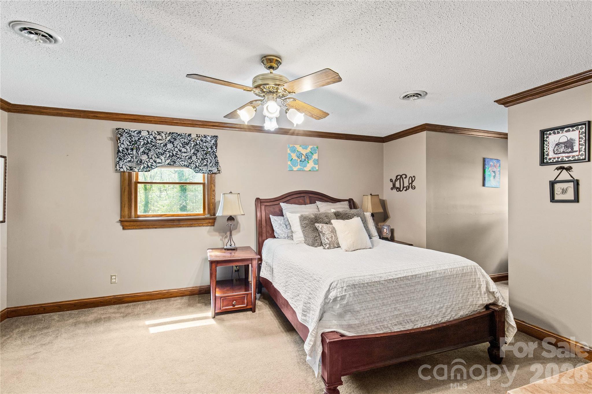 529 Langley Road Lancaster, SC 29720 - Photo 29 of 48 a bedroom with a bed and a chandelier