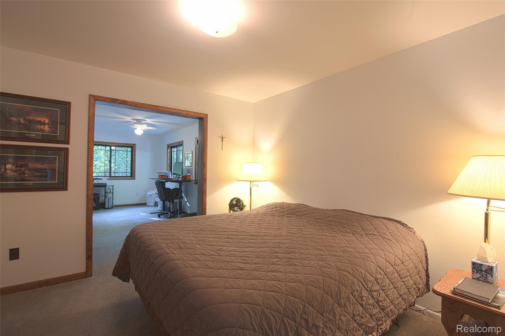 5799 Goodar Road South Branch, MI 48761 - Photo 32 of 58 Carpeted 1st floor bedroom with an open doorway to a separate den or additional 2nd bedroom area