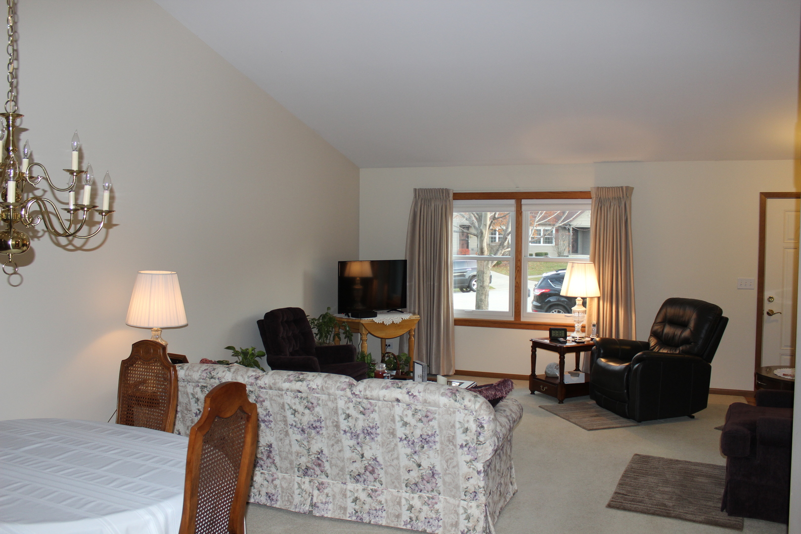 737 Alice Place Elgin, IL 60123 - Photo 2 of 28 a bedroom with furniture and a window