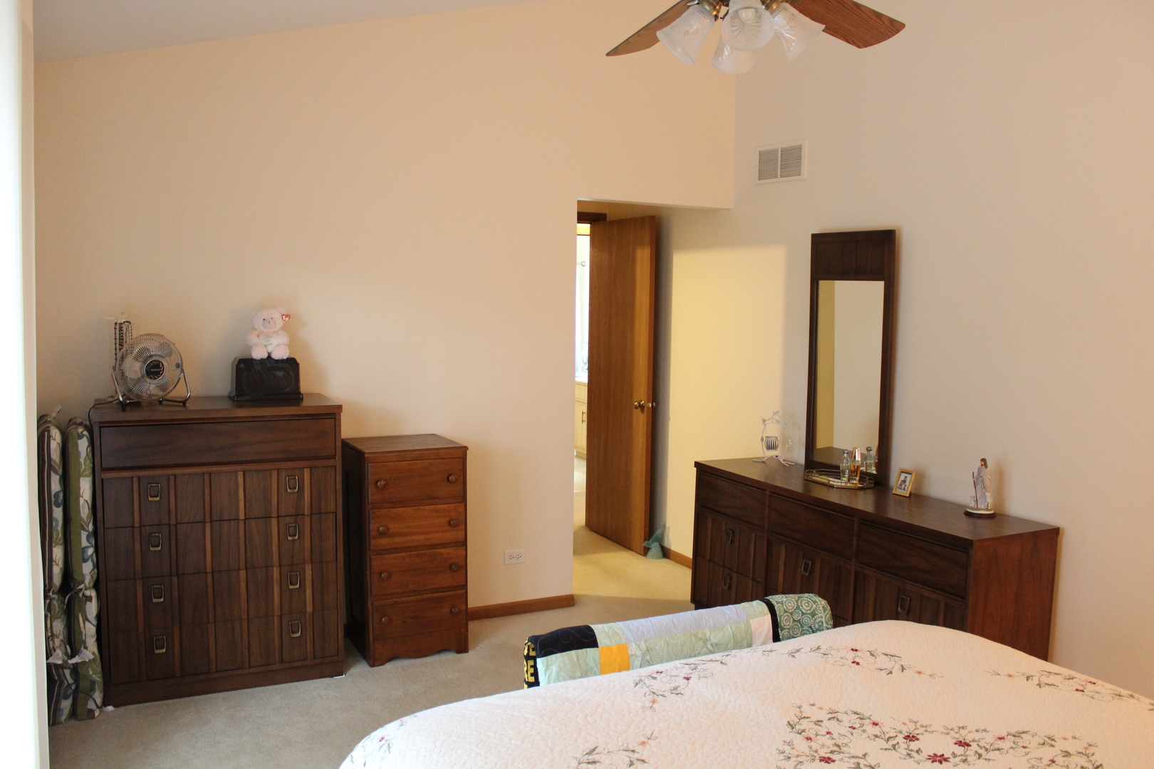 737 Alice Place Elgin, IL 60123 - Photo 11 of 28 a bedroom with a bed and a dresser