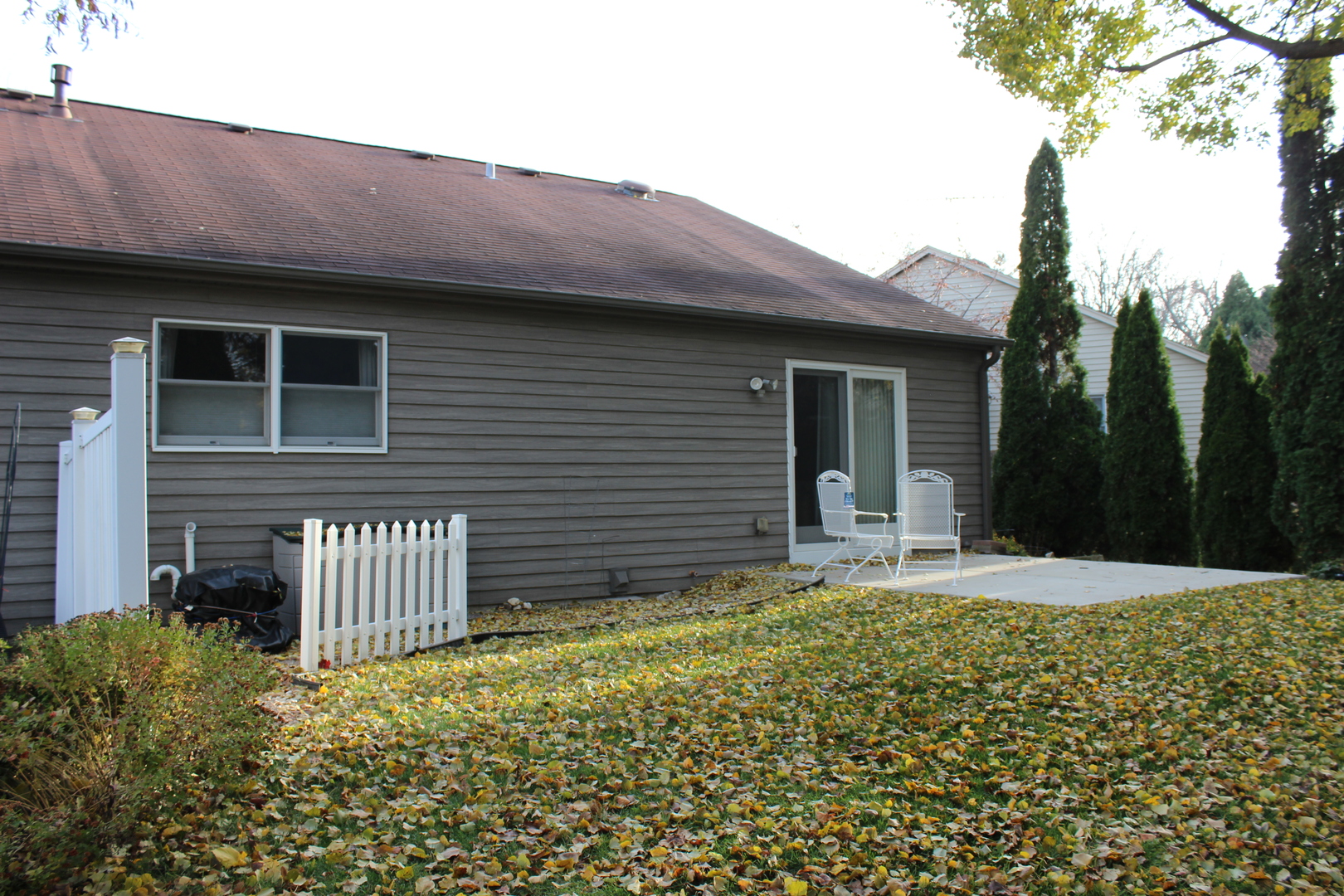 737 Alice Place Elgin, IL 60123 - Photo 26 of 28 a front view of a house with garden