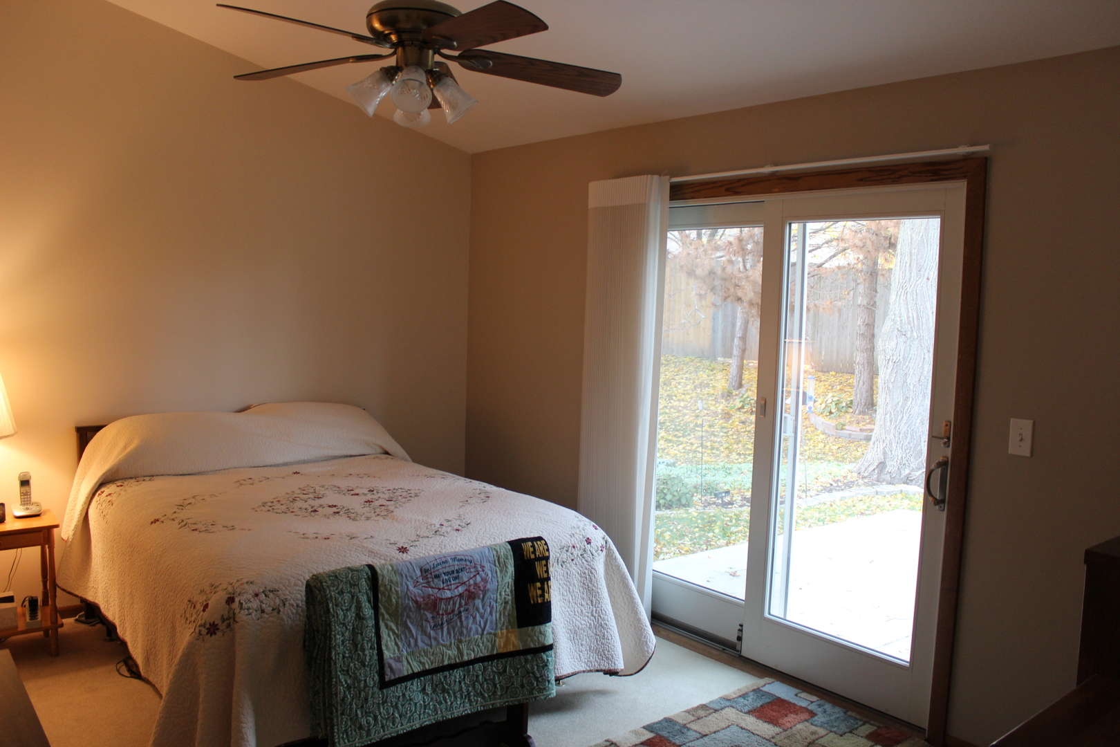 737 Alice Place Elgin, IL 60123 - Photo 10 of 28 a bedroom with a bed and a window