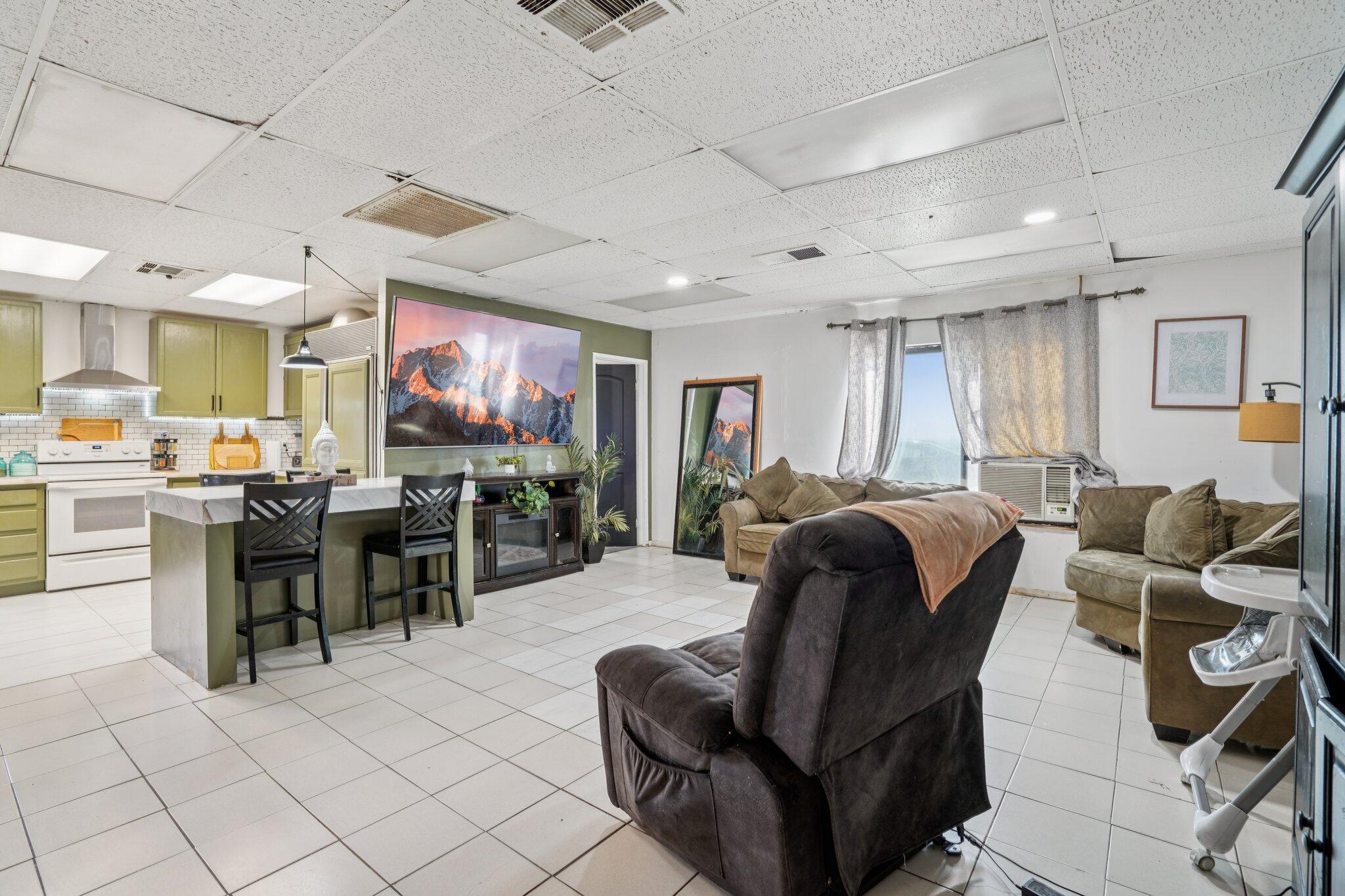 2154 Riviera Circle Thermal, CA 92274 - Photo 11 of 43 a living room with furniture and a large window