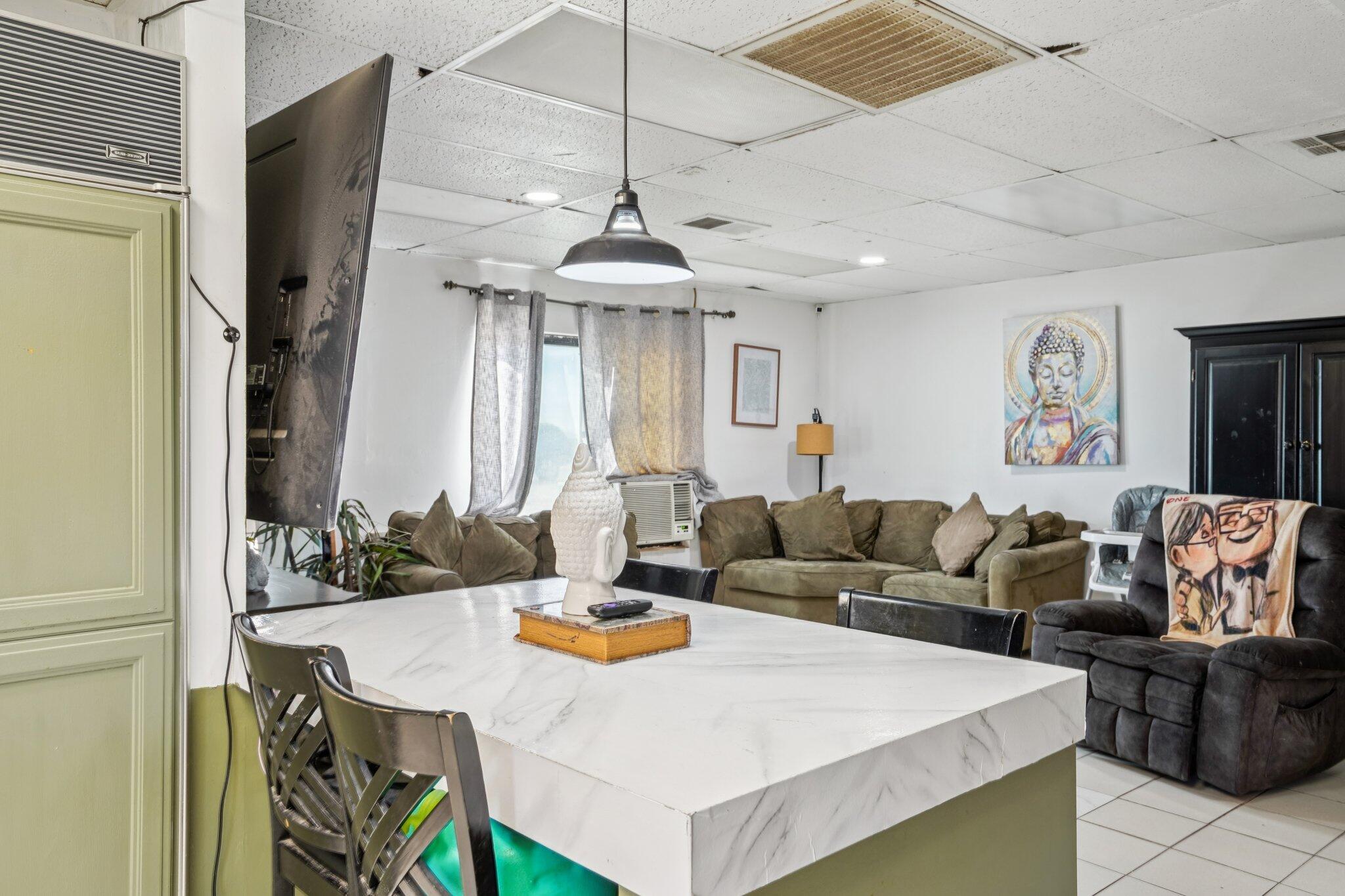 2154 Riviera Circle Thermal, CA 92274 - Photo 14 of 43 a living room with furniture a chandelier and a flat screen tv