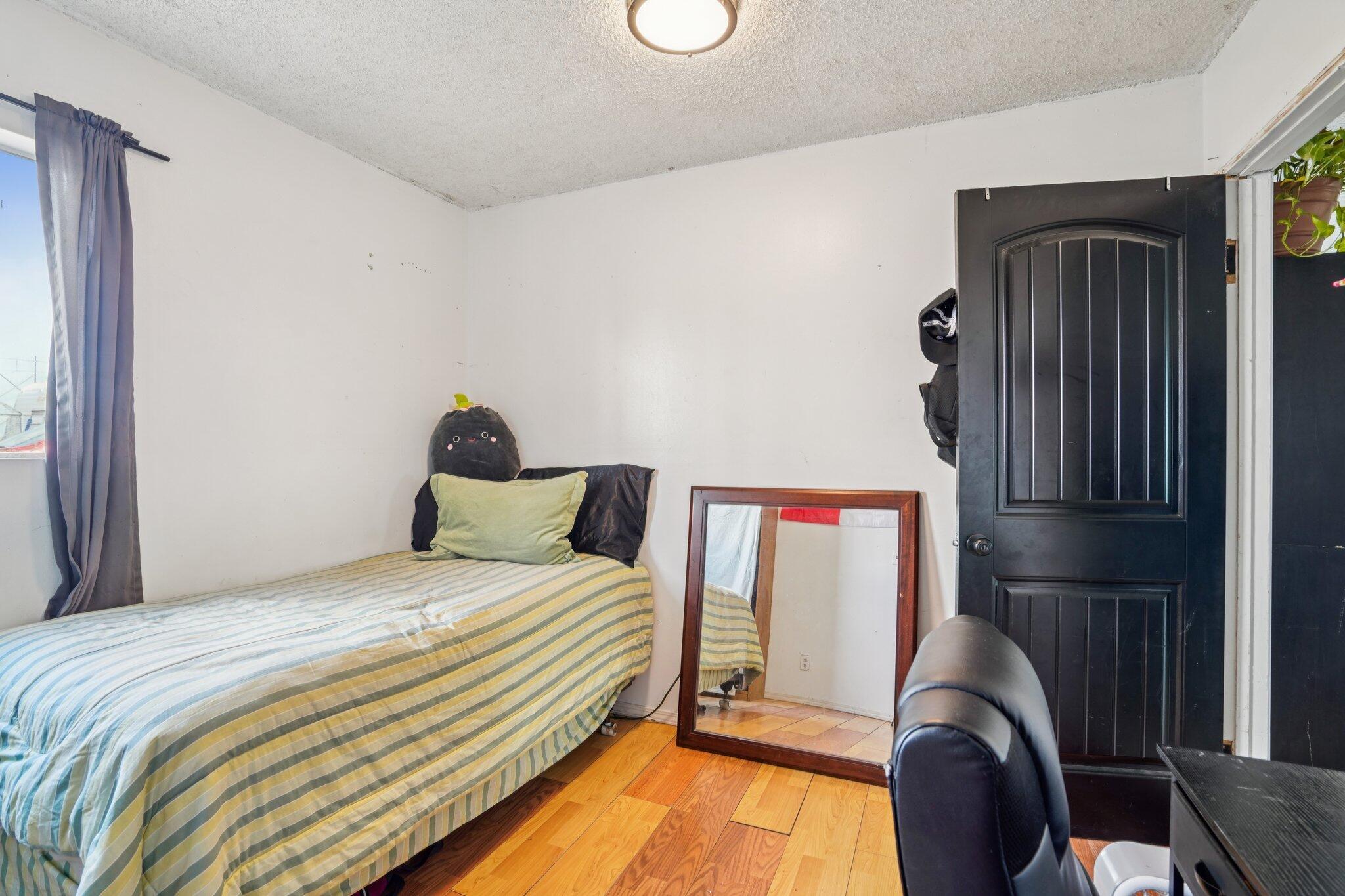 2154 Riviera Circle Thermal, CA 92274 - Photo 22 of 43 a bedroom with a bed and window