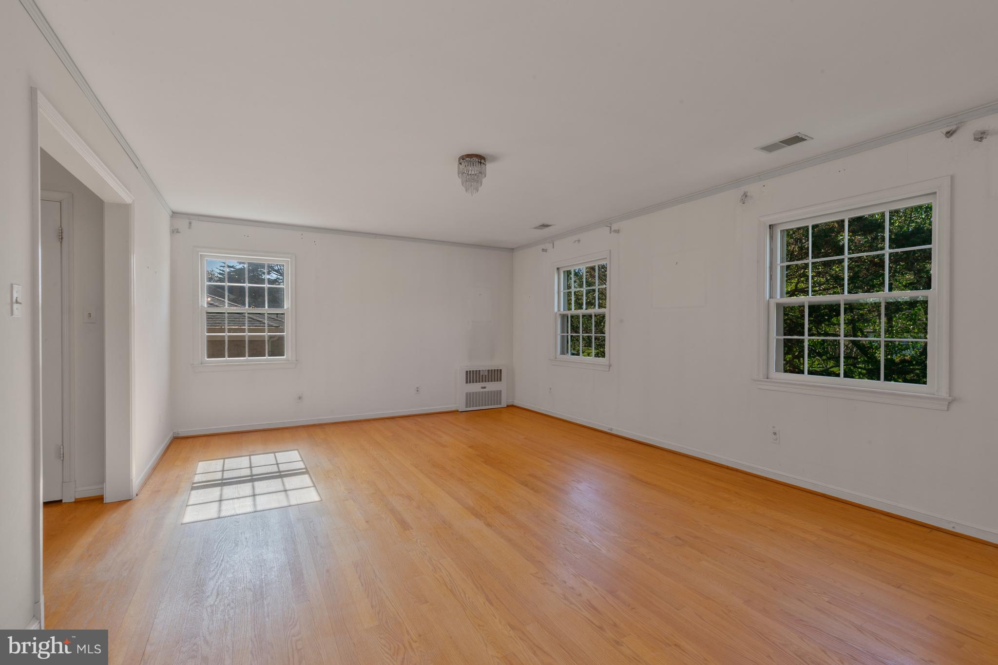6315 Stoneham Lane McLean, VA 22101 - Photo 13 of 18 a view of empty room with wooden floor and fan