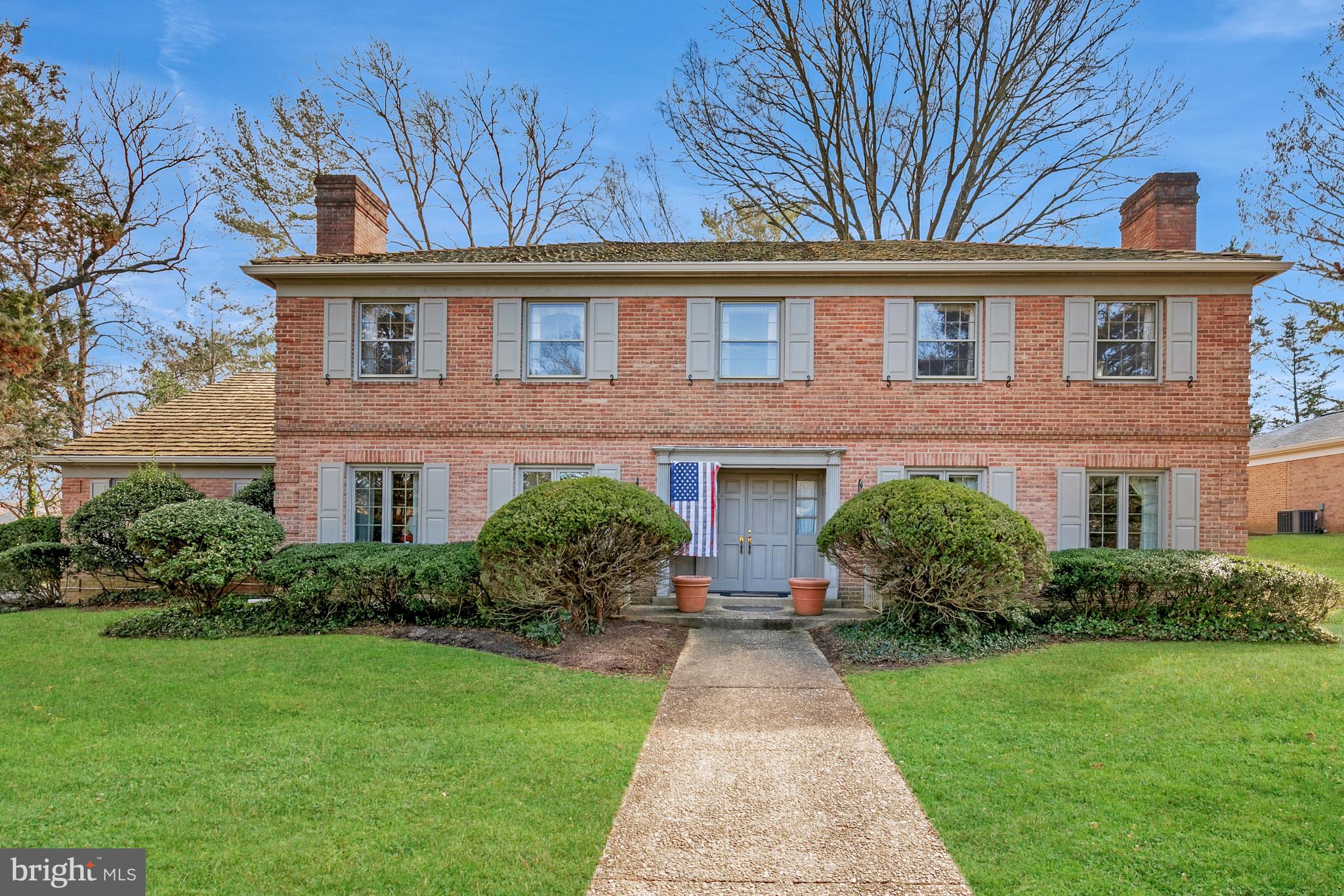 6315 Stoneham Lane McLean, VA 22101 - Photo 2 of 18 a front view of a house with a yard