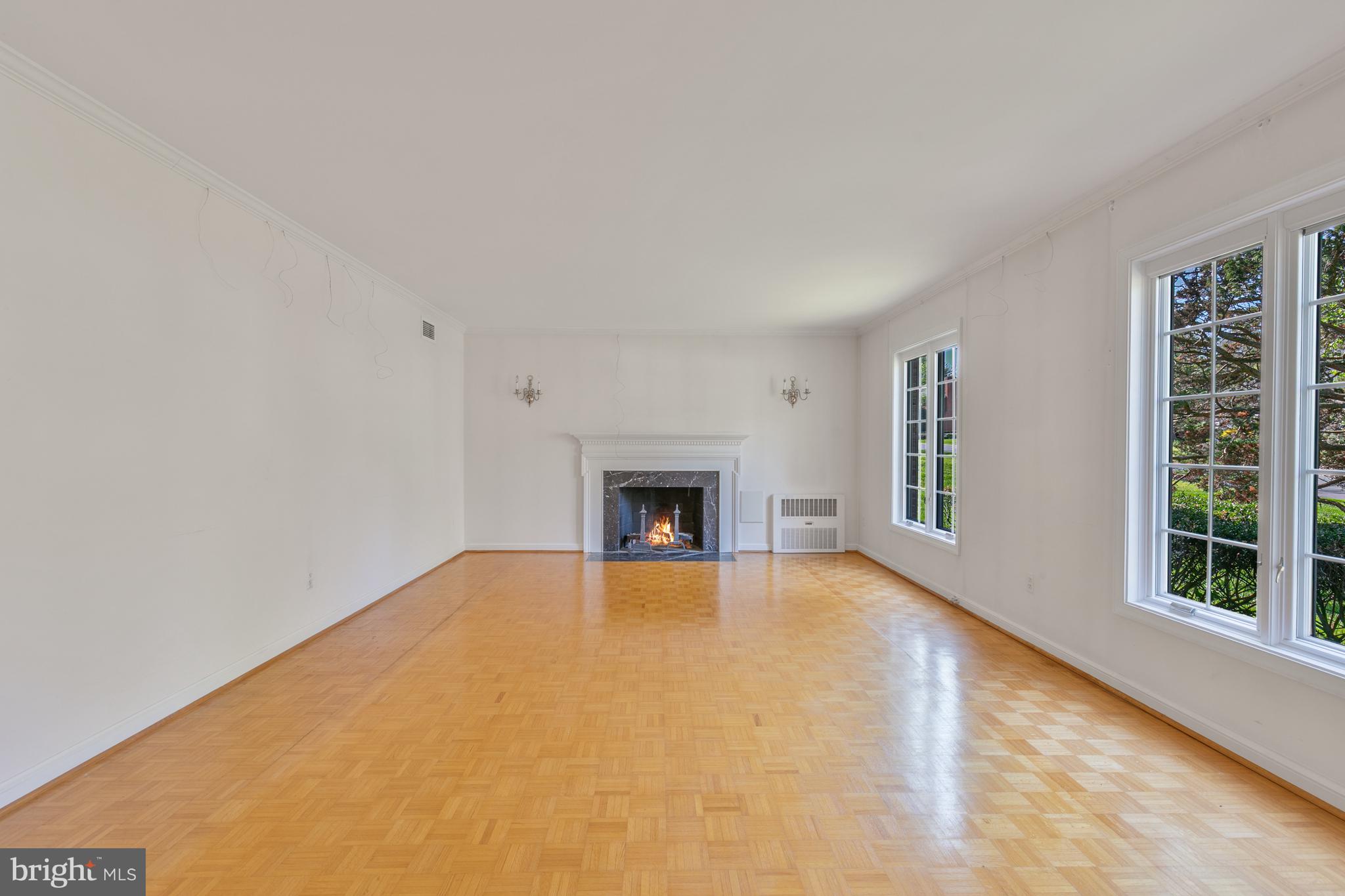 6315 Stoneham Lane McLean, VA 22101 - Photo 5 of 18 a view of an empty room with a window and fireplace