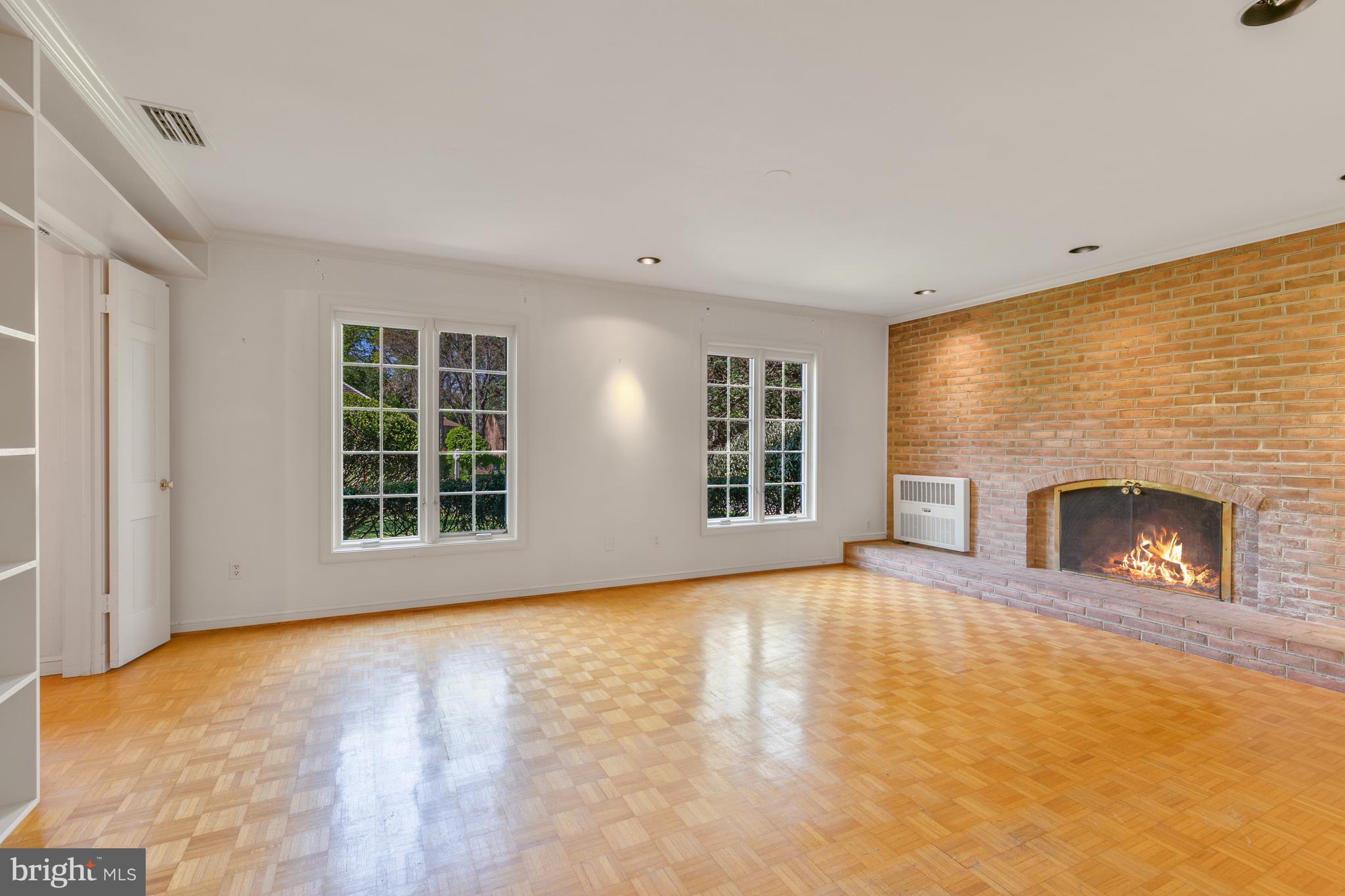 6315 Stoneham Lane McLean, VA 22101 - Photo 7 of 18 a view of an empty room with a fireplace and a window