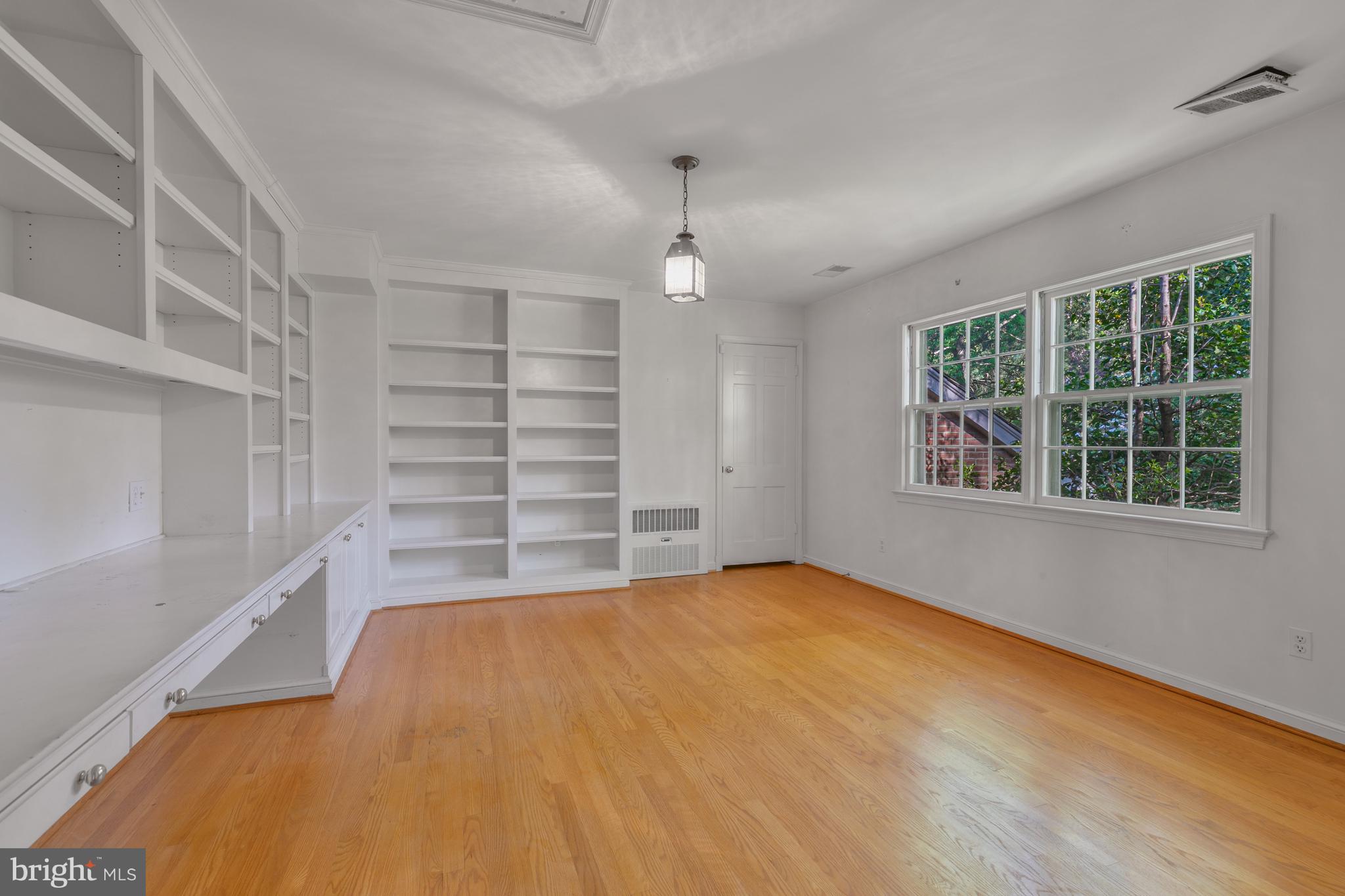 6315 Stoneham Lane McLean, VA 22101 - Photo 10 of 18 wooden floor in an empty room with a window