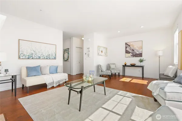 a living room with furniture and a rug