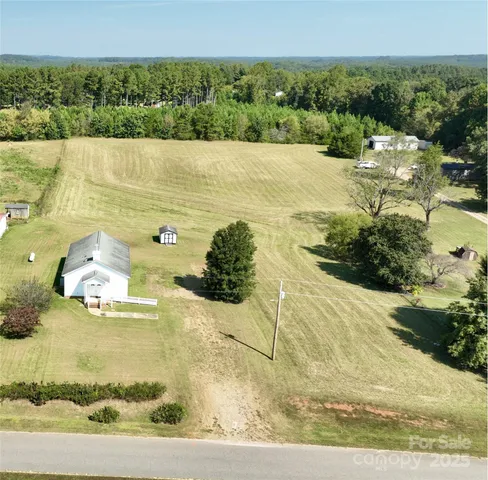 a view of a garden with an outdoor seating
