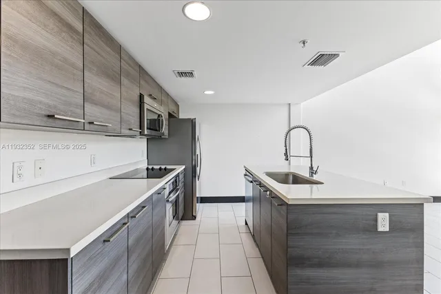 a kitchen with sink cabinets and outdoor view