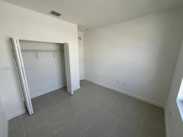 an empty room with mirror