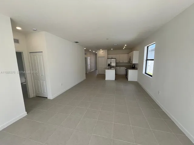 a view of a living room and dining room