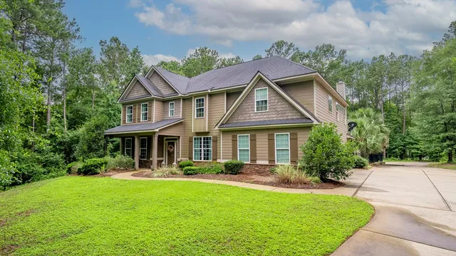 a front view of a house with garden