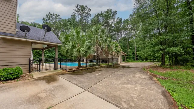 a view of a backyard with a sitting area